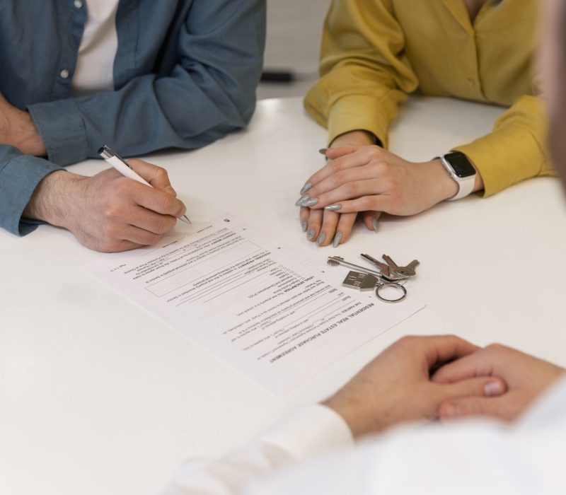 male-real-estate-agent-doing-business-showing-house-potential-buying-couple